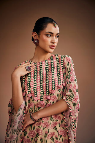 Floral printed kurta paired with striped pants and delicate heart shape tassels.