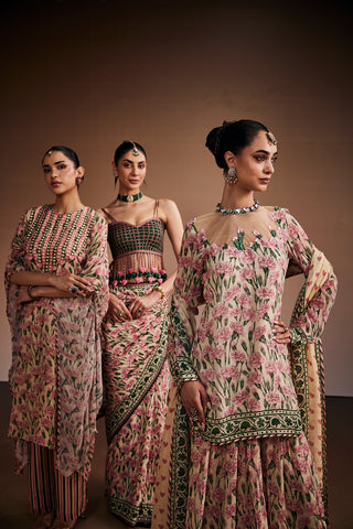 Floral printed kurta paired with striped pants and delicate heart shape tassels.