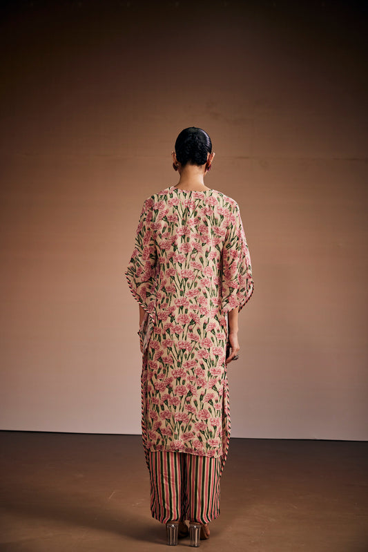 Floral printed kurta paired with striped pants and delicate heart shape tassels.