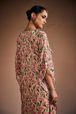 Floral printed kurta paired with striped pants and delicate heart shape tassels.